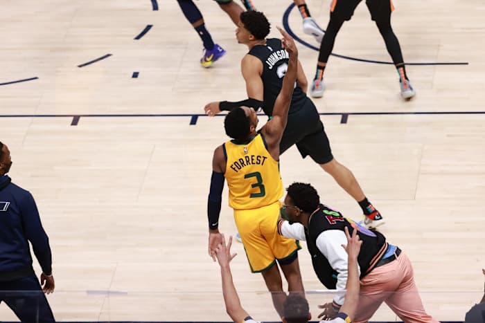 Donovan Mitchell celebrates with Trent Forrest (3) after Forrest hit a three pointer against the Spurs